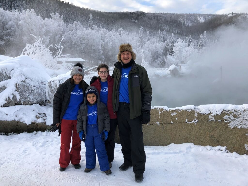 Make-A-Wish kid Landon with familyu in winter outside